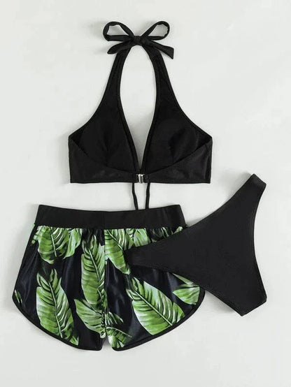 A stylish 3-piece swimsuit set featuring a unique leaf print design, including a top, bottoms, and matching shorts.