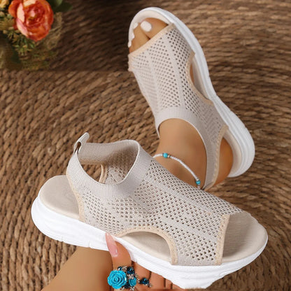 Women's platform sports sandals in black with mesh lining and a flat toe rubber sole.