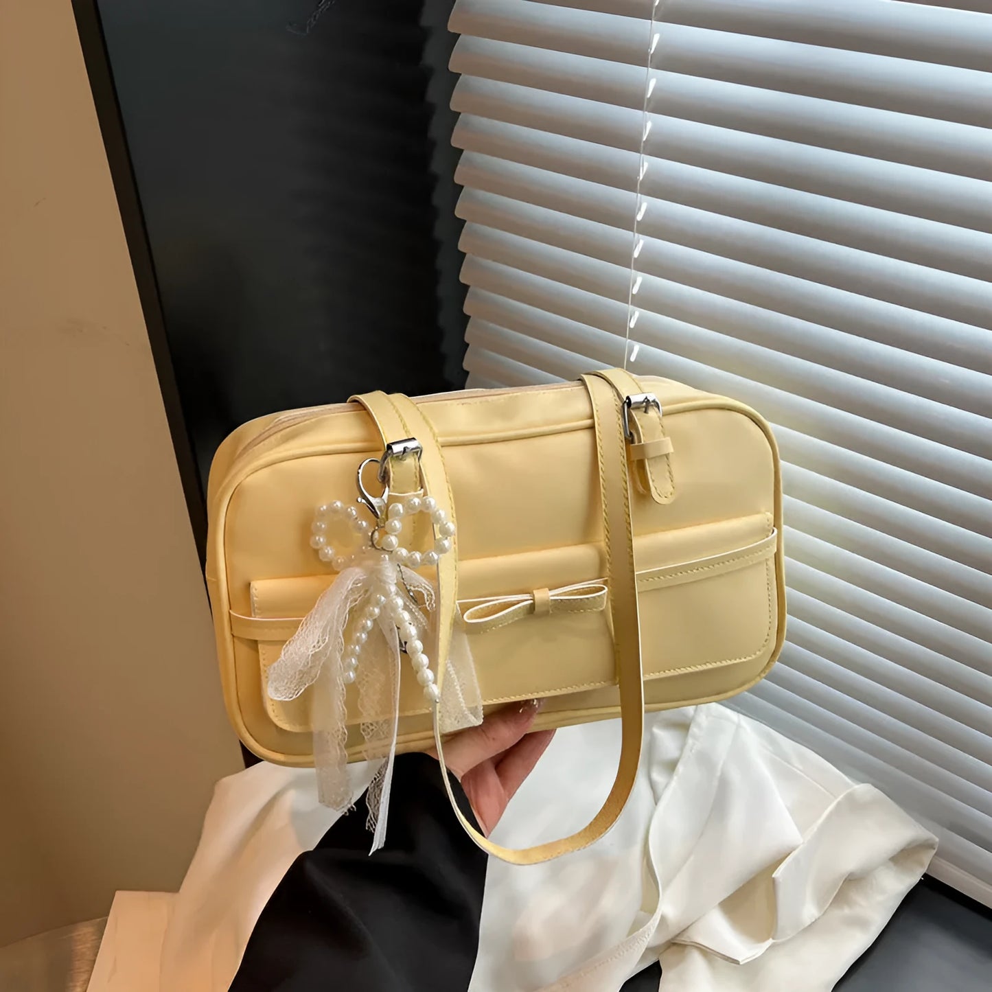 PU single-shoulder flap bag in horizontal square shape with mobile phone compartment and bow decorations