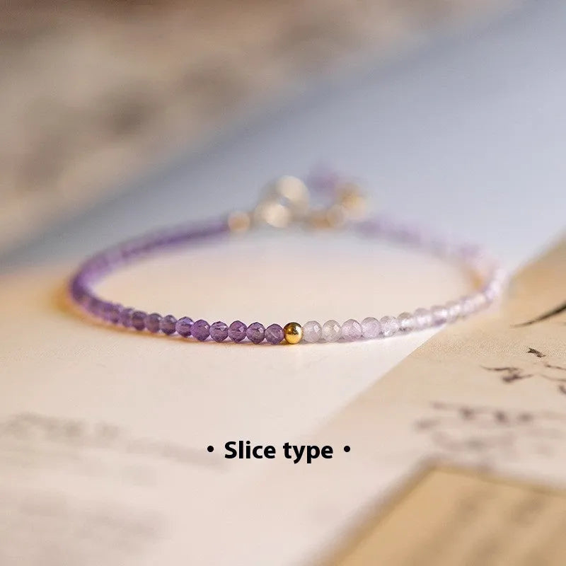 Purple geometric crystal bracelet threaded on 2mm purple rattan.