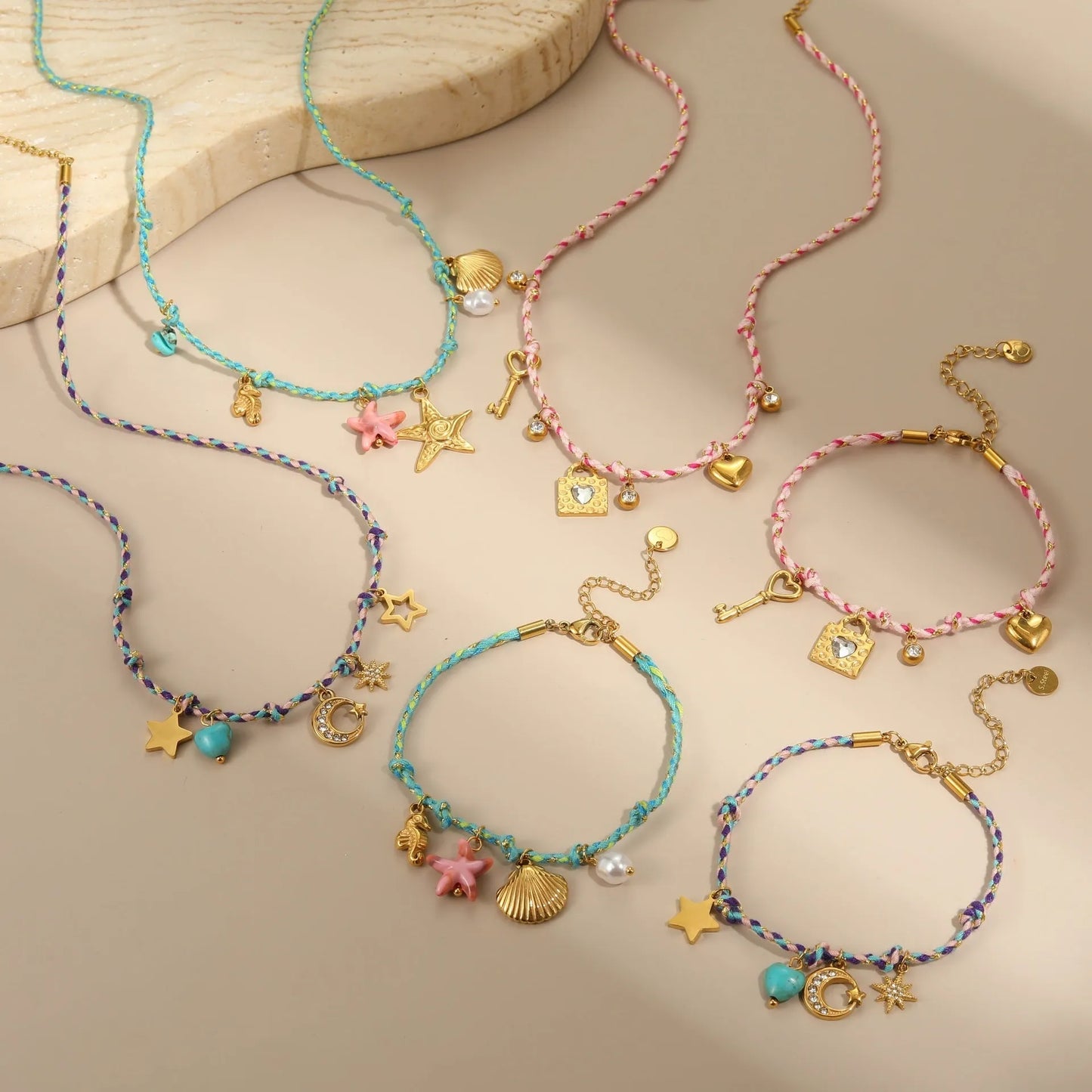 Handmade braided rope titanium steel necklace and bracelet with heart pendant on 18K gold plated chain.