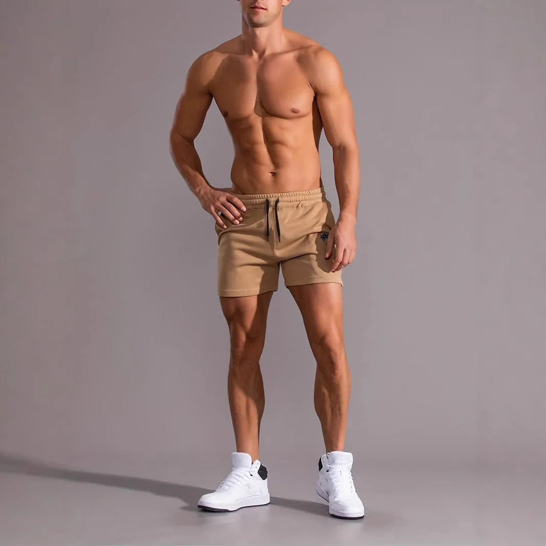 Khaki coconut print men's sports shorts with elastic waistband and straight leg design