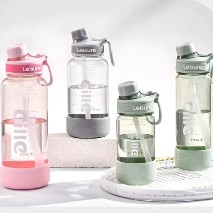 Grey portable plastic cup with built-in straw, shown in 1000ml size with modern cylindrical design.