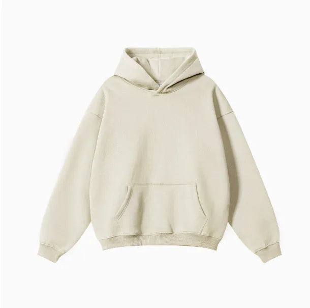 Men's grey terry hooded sweater with drop-shoulder sleeves and front pocket, showing textured cotton fabric