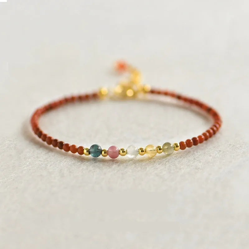 Women's freshwater pearl bracelet with stainless steel magnetic clasp on clear elastic cord