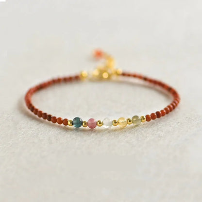 Women's freshwater pearl bracelet with stainless steel magnetic clasp on clear elastic cord
