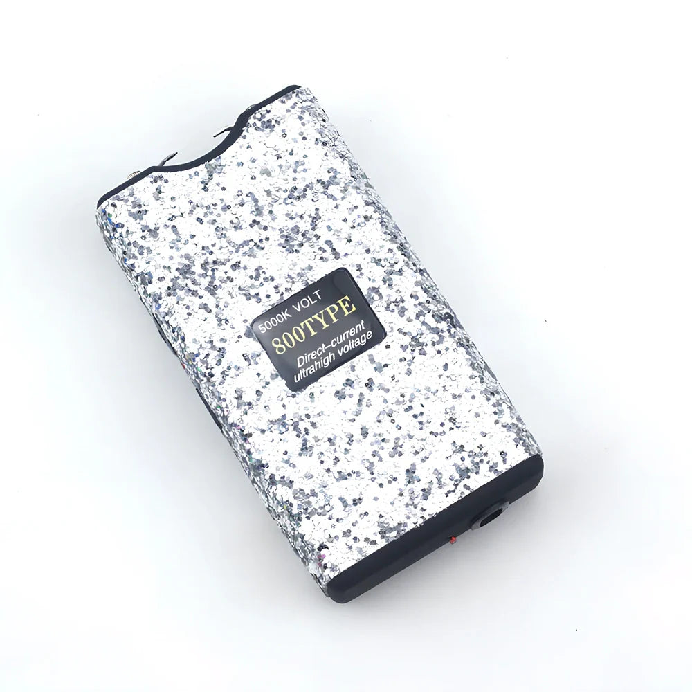 Purple self-defence torch with 100-lumen LED and emergency alarm function measuring 15cm