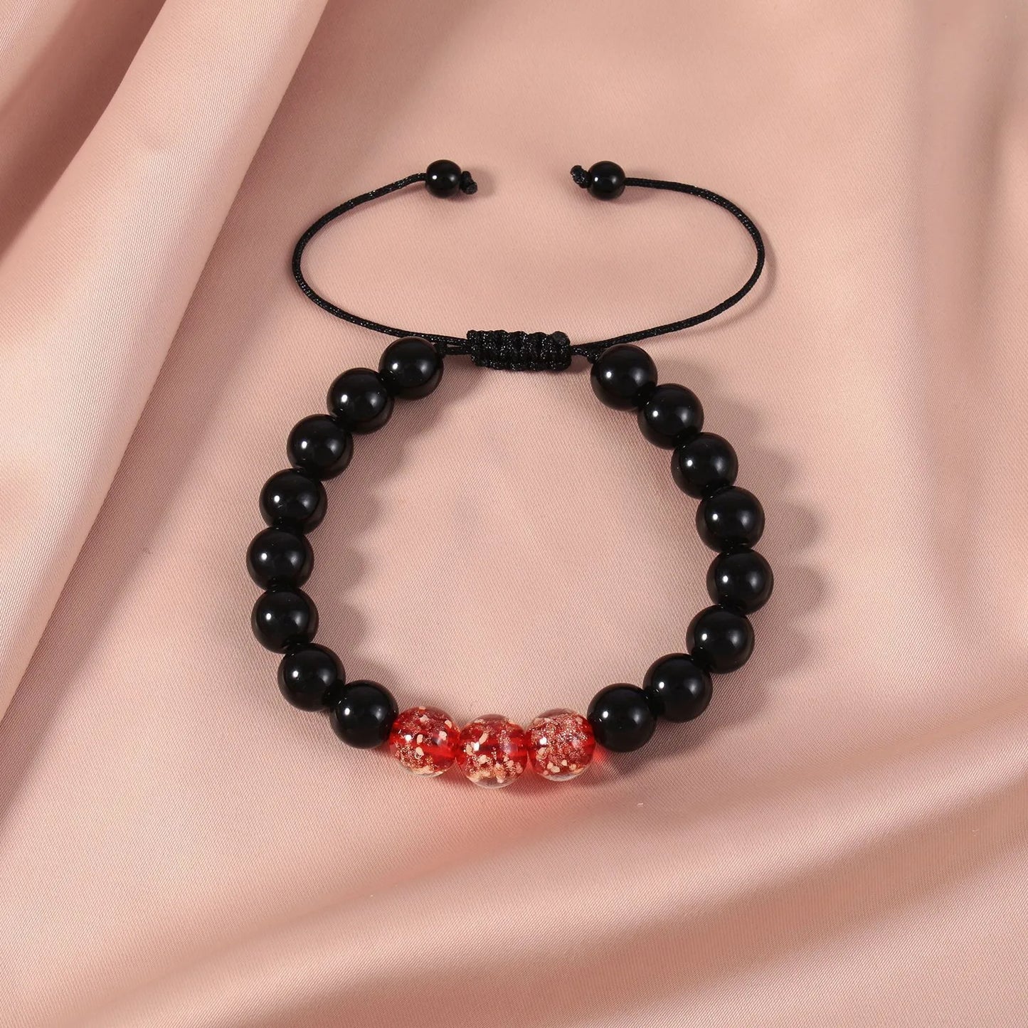 Adjustable bracelet with luminous geometric glass beads in six colour options on a wrist