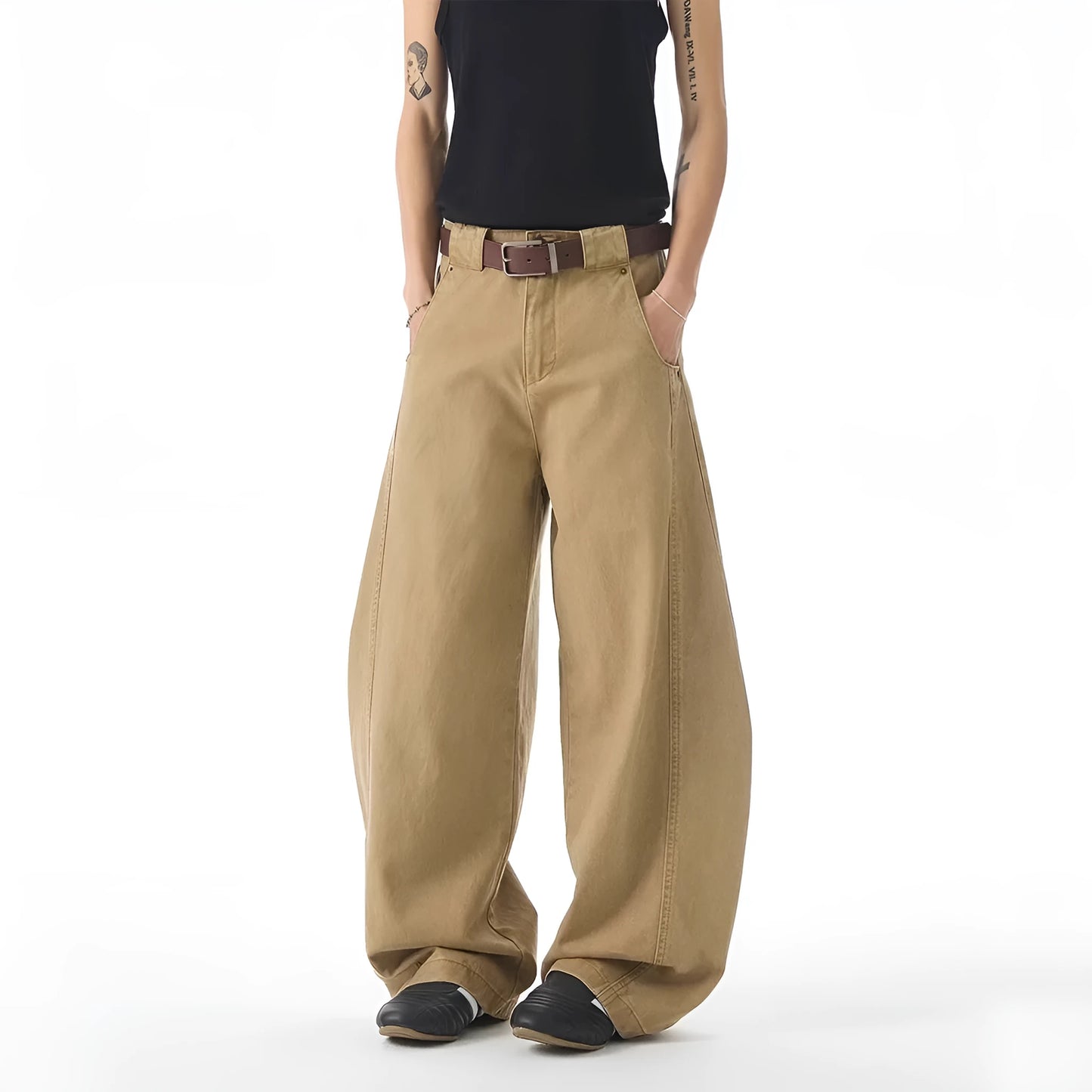 Brown men's loose fit straight leg jeans with a button fly on a mid waist.