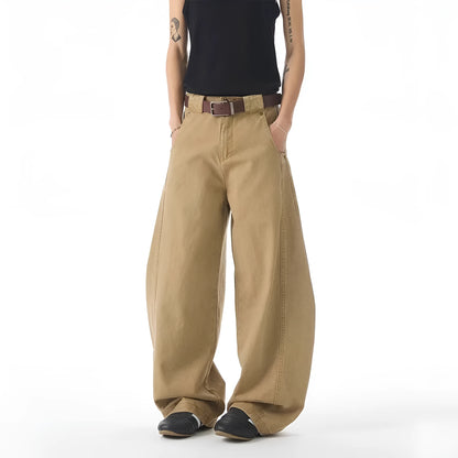 Brown men's loose fit straight leg jeans with a button fly on a mid waist.
