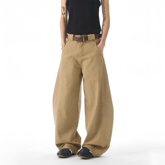 Brown men's loose fit straight leg jeans with a button fly on a mid waist.