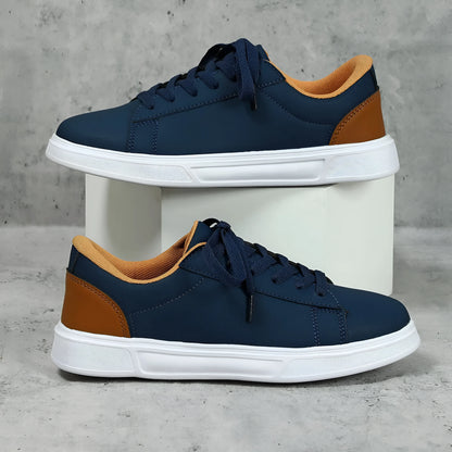 Beige brown women's low-top platform casual sneakers with a cross strap and round toe on a white background.