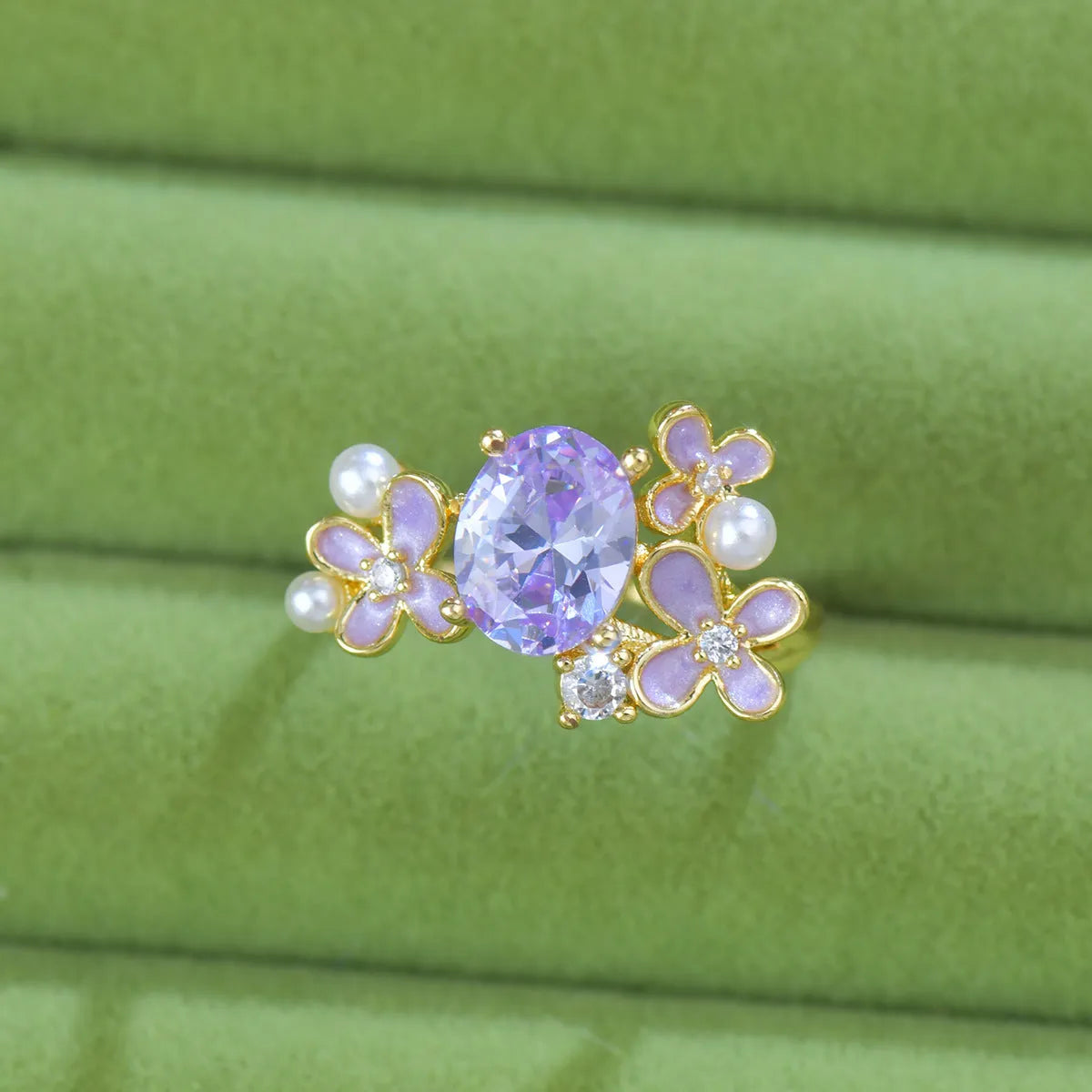 Adjustable open ring with flower design featuring pearl and zircon elements in yellow or light purple finish