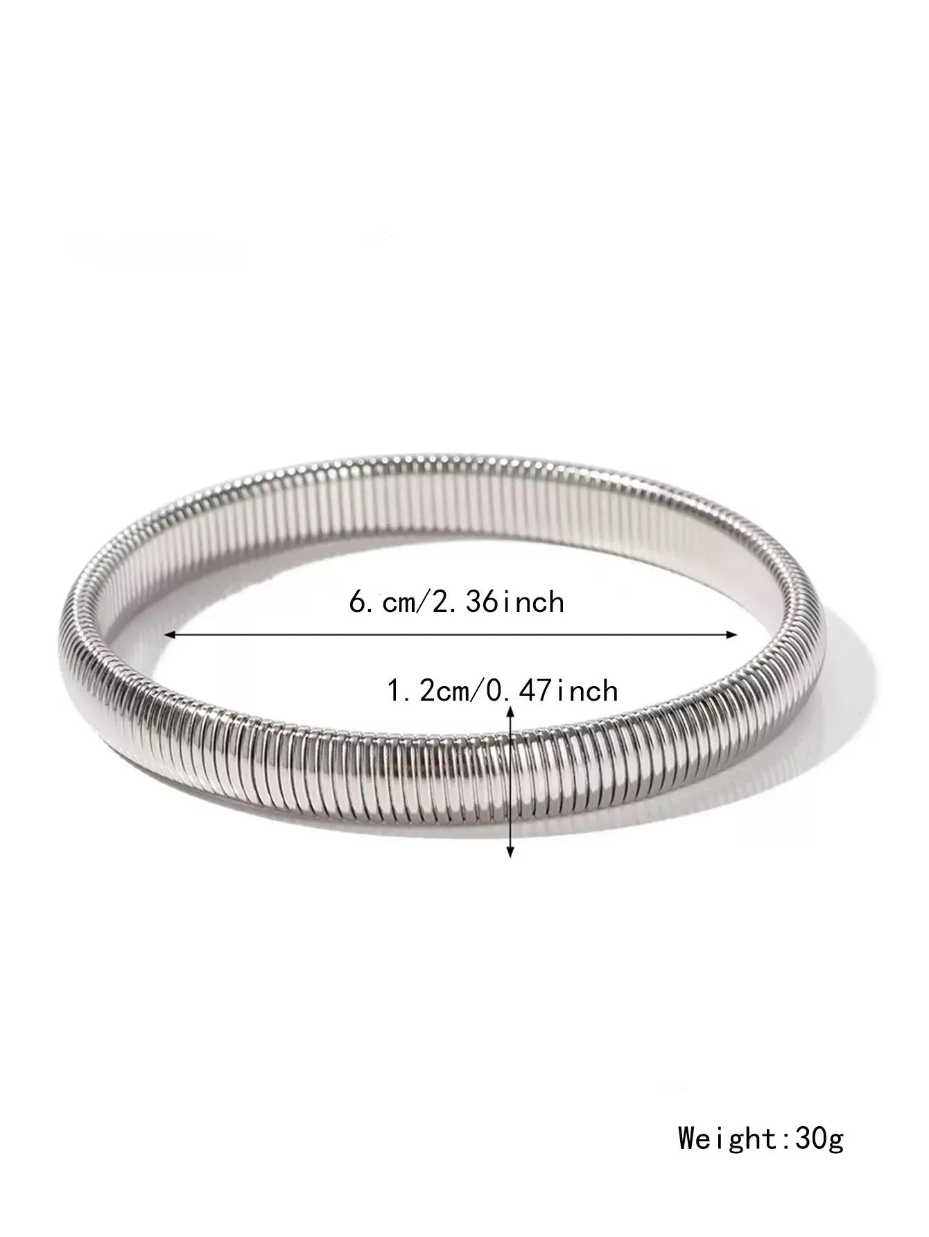 Women's titanium steel elastic bracelet with a vertical stripe pattern in gold, shown on a wrist.