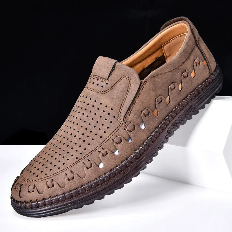 Men's brown slip-on casual shoes with round toe and flat sole shown on a white background