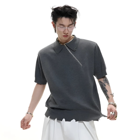 Men's slim-fit black knitted polo shirt with an oblique diagonal zipper and short sleeves.
