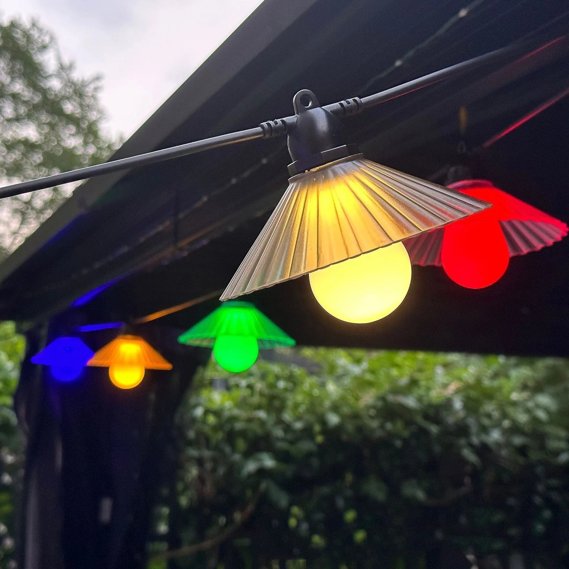Outdoor LED string lights with flower-shaped bulbs in warm white or multicolour options
