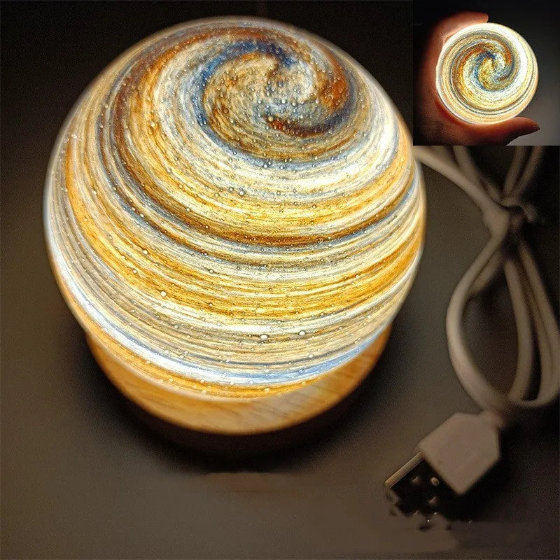 Planet-shaped USB night light with adjustable dimming in 12 colour options on its base.