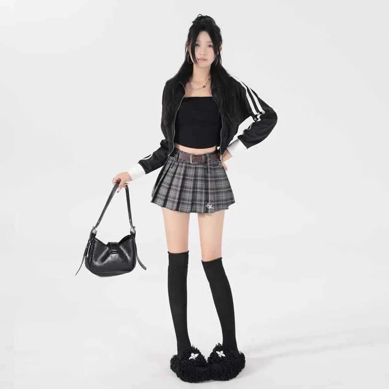 High-waisted cotton A-line skirt with pleated design in black plaid pattern, showing spandex blend stretch and A-line silhouette