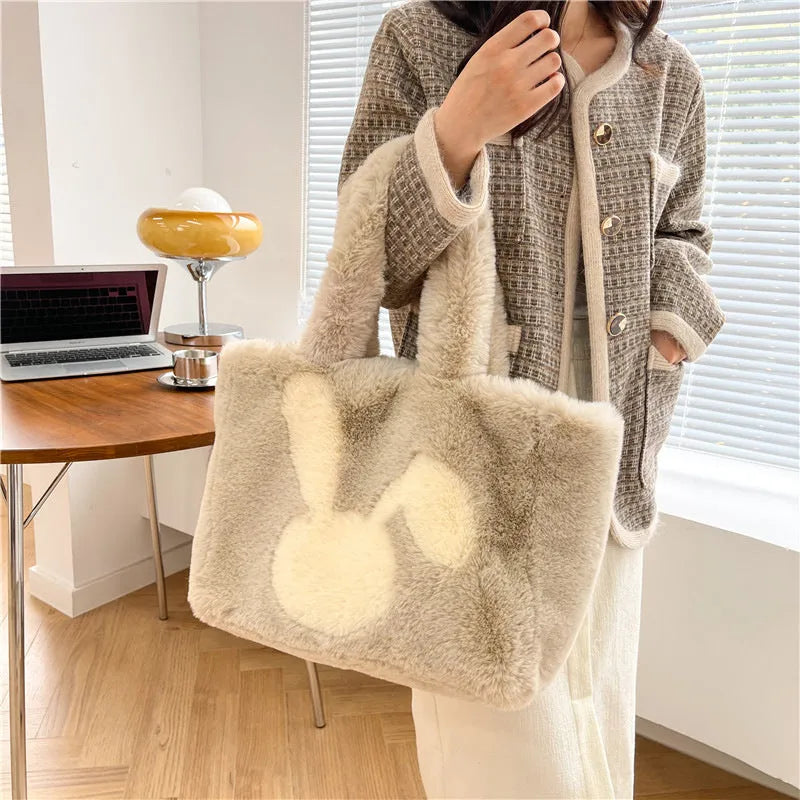 Cute cartoon rabbit ears design on a soft plush large capacity shoulder tote bag.