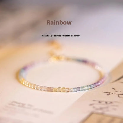 Women's handmade bracelet with rainbow fluorite stones in copper geometric quadrilateral settings