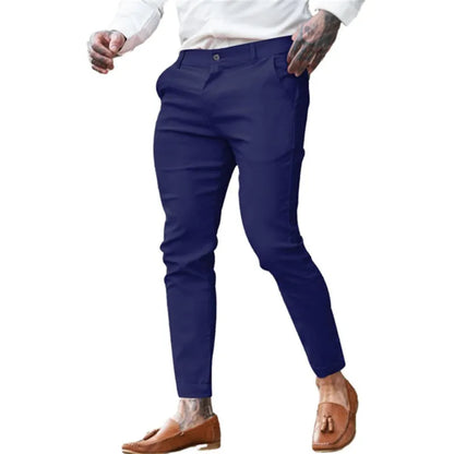 Men's slim fit elastic cotton pencil trousers in a solid colour on a hanger, showing the zip fly and mid waist design.