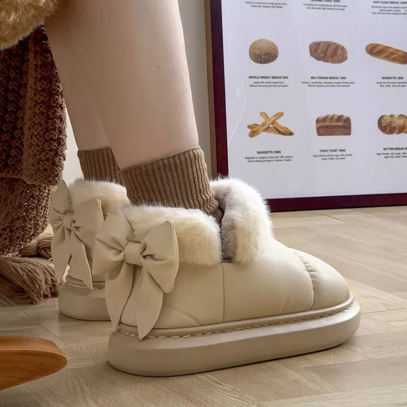 Women's winter ankle boots with non-slip sole and furry bow in white, khaki, and black