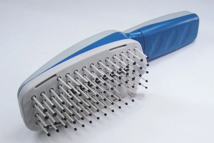White pet grooming comb with negative ion and ozone technology, removable brush head, 21.5cm long.