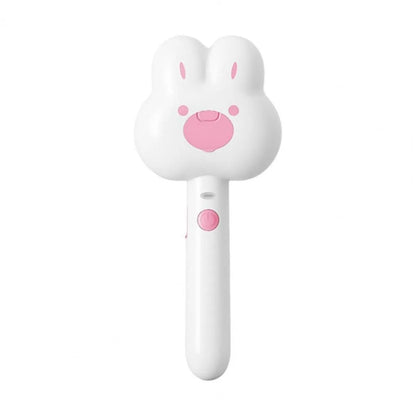 Rechargeable cat grooming comb with steam function in cartoon design, showing long handle and brush head
