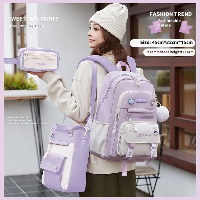 Pink waterproof Oxford cloth school backpack for girls with curved shoulder straps, shown with matching pencil case.