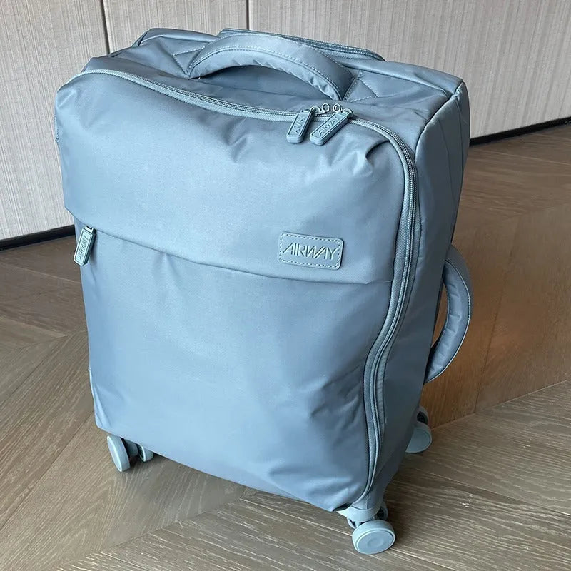 Ultra-light waterproof Oxford cloth suitcase in bluestone green with universal wheels and breathable lining