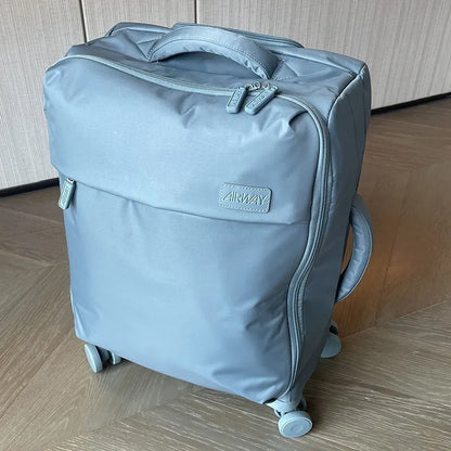 Ultra-light waterproof Oxford cloth suitcase in bluestone green with universal wheels and breathable lining