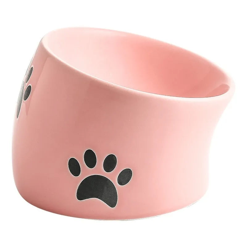 Ceramic cat bowl with high foot and cat's paw base in an oblique mouth design.