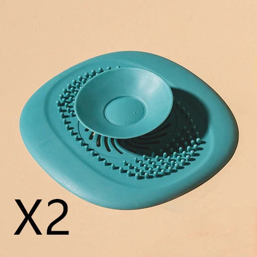 TPR vortex design sink drain cover in twilight orange, quiet blue, mango yellow, and gentian green