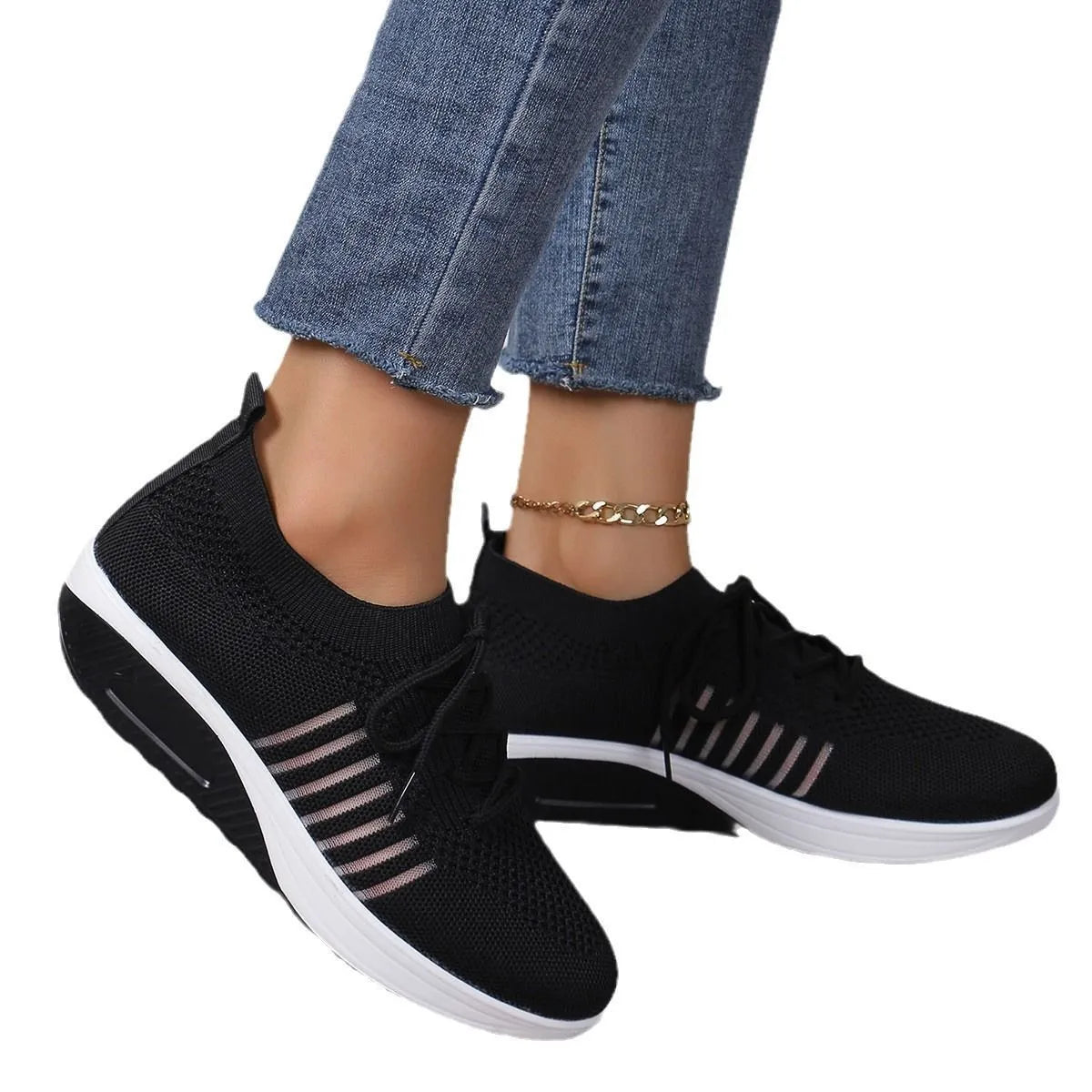 Women's red platform sneakers with mesh upper and front lace-up design on rubber sole