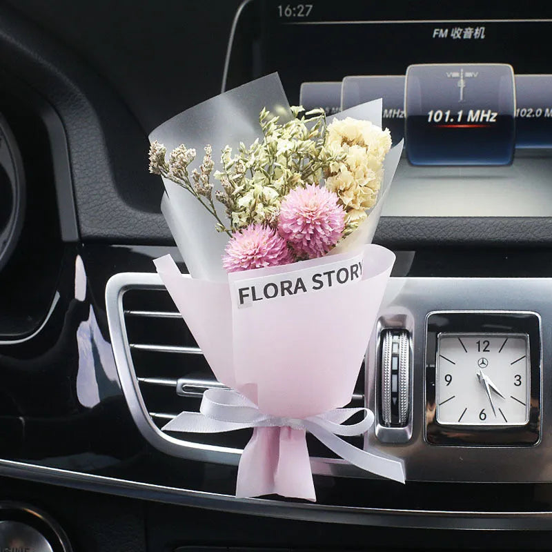 Mini dried flower bouquet mounted in car air vent for decorative aromatherapy