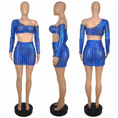 Women's black hollow-out net sleeveless top and short skirt two-piece set.