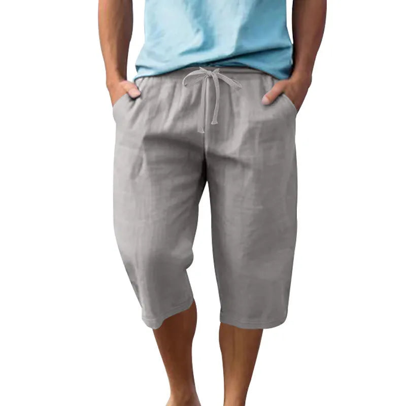 Men's linen shorts in light blue with drawstring waist and cropped straight-leg design