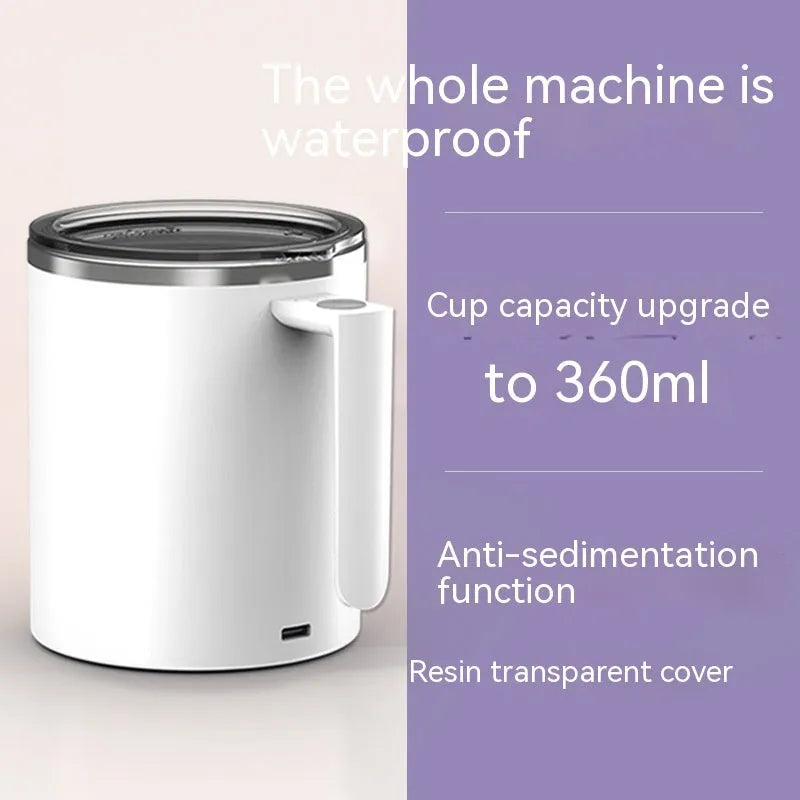 White automatic magnetic stirring coffee cup with stainless steel interior on a desk