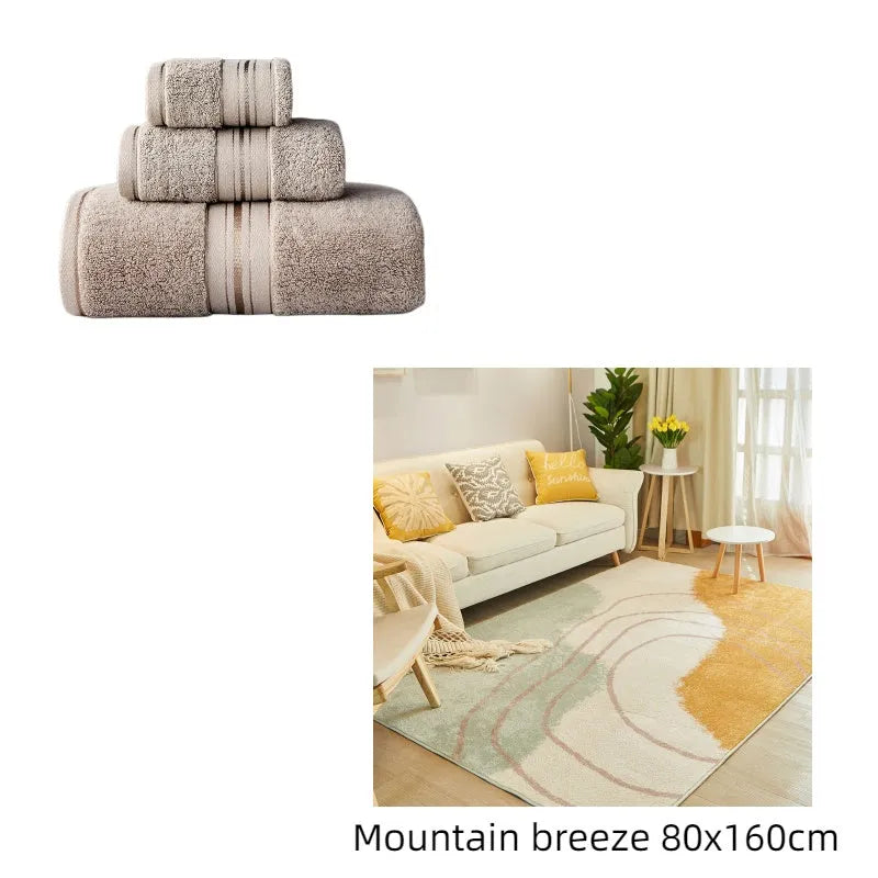 Three-piece cotton towel set showing bath towel, towel, and square scarf in coordinating colours