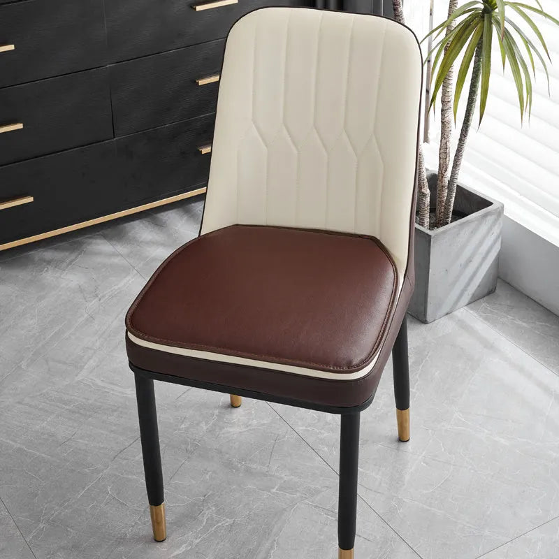 Leather horseshoe-shaped seat cushion in beige colour on a chair, showing non-slip base and 2.5cm thickness.