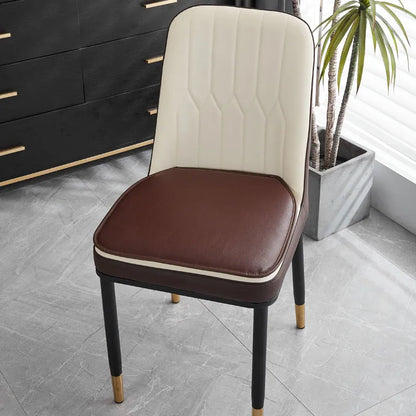 Leather horseshoe-shaped seat cushion in beige colour on a chair, showing non-slip base and 2.5cm thickness.
