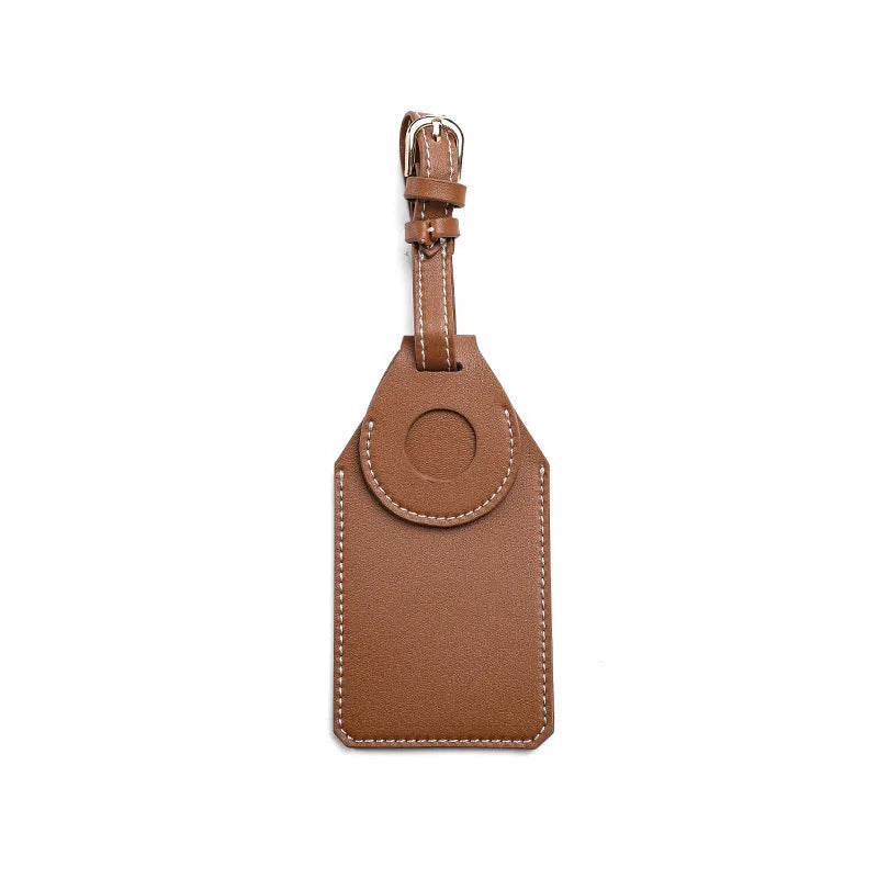 Luggage tag tracker protective cover in black, brown, and orange colours made from PU/PVC material.