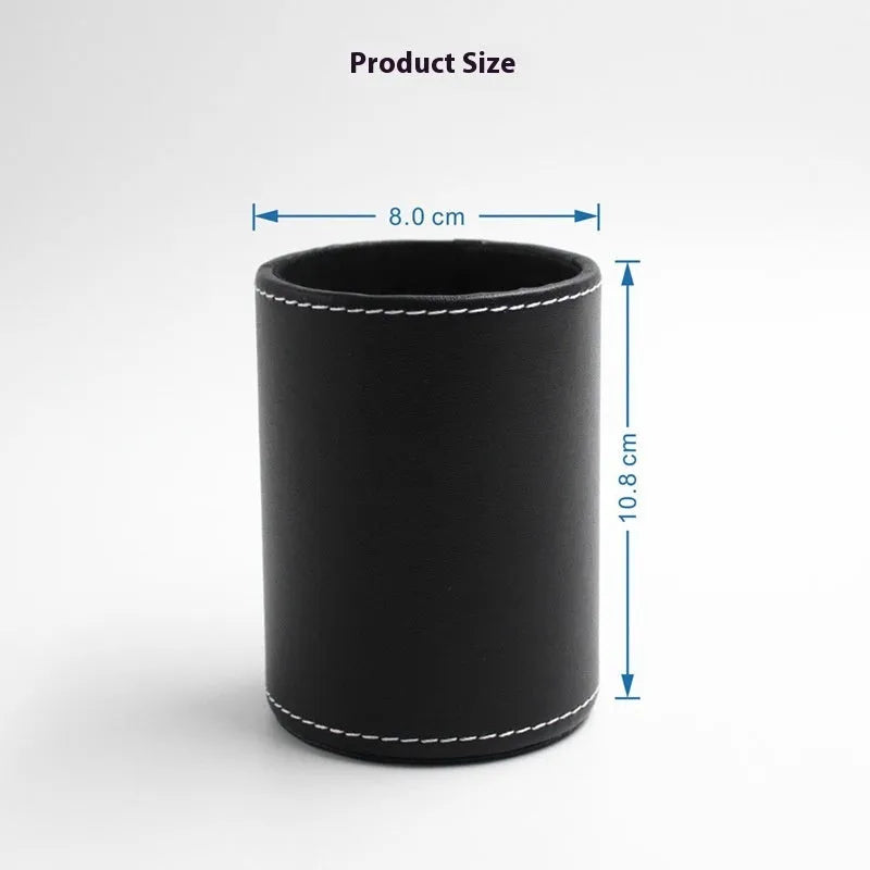 Round black leather pen container measuring 8.0cm diameter by 10.8cm height on wooden desk