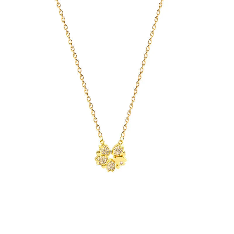 Elegant four-leaf clover pendant necklace with sparkling crystal heart detail, made of premium stainless steel for women's fashion jewelry gift