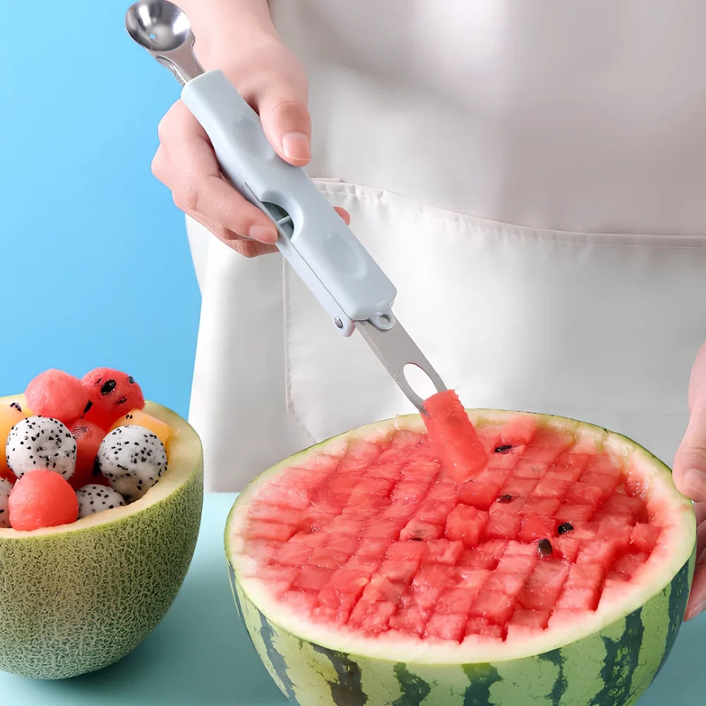 Three-in-one stainless steel watermelon ball digger in grass green, 24cm long with hidden knife and 10cm scoop for fruit slicing