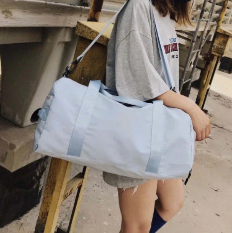 Premium durable fitness gym bag with separate compartments for shoes, laundry, and other gear, made of water-resistant materials for versatile use