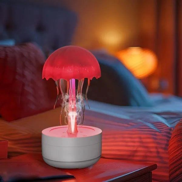 White resin jellyfish humidifier and essential oil diffuser with colourful night light on a desktop.