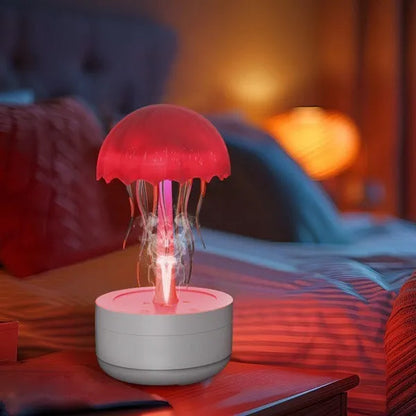 White resin jellyfish humidifier and essential oil diffuser with colourful night light on a desktop.
