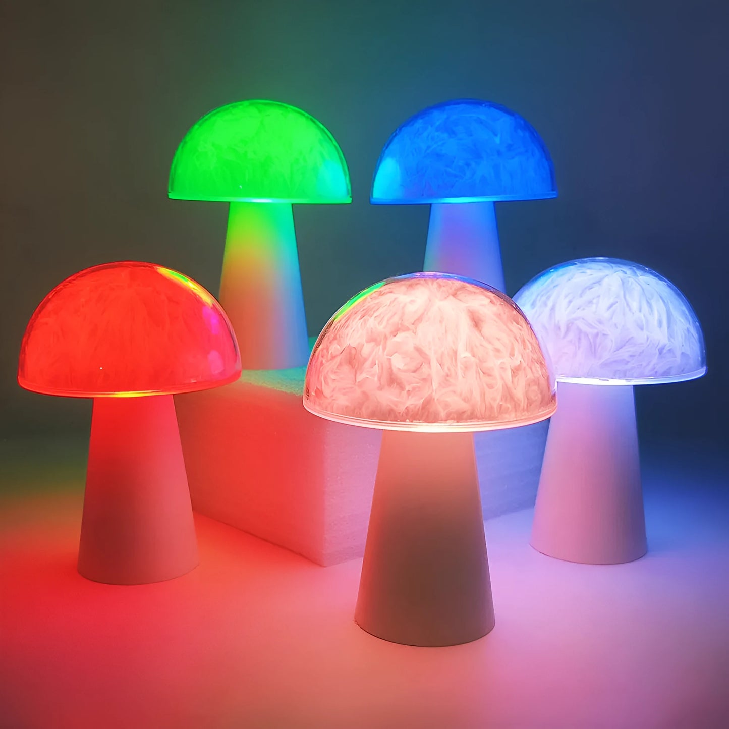 Mushroom-shaped RGB colour-changing night light with remote control on a wooden surface